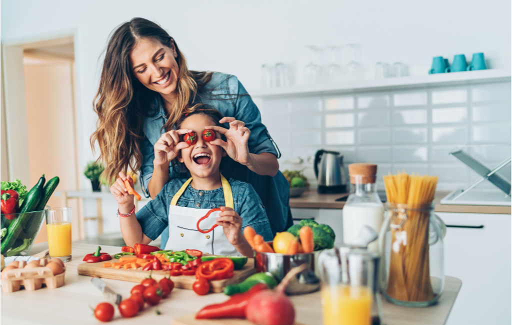 mother cooking with young daughter