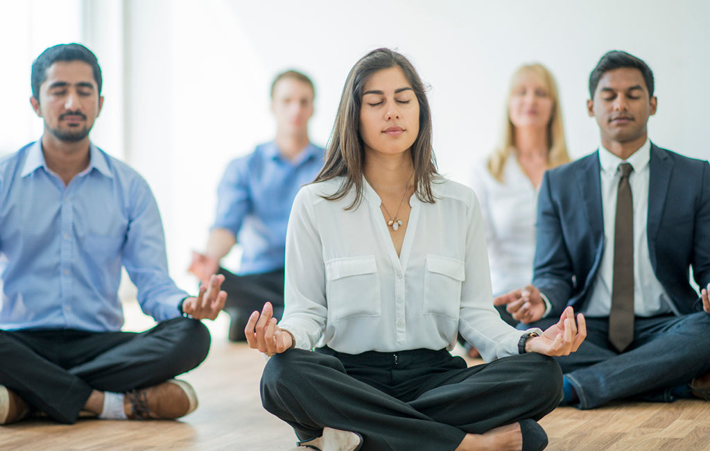 business professionals meditating