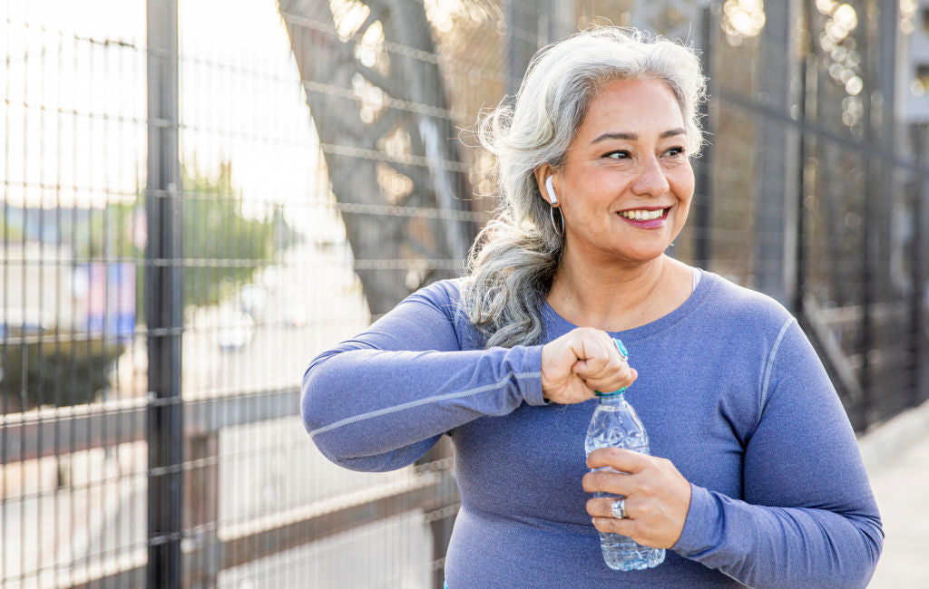 older woman drinking water