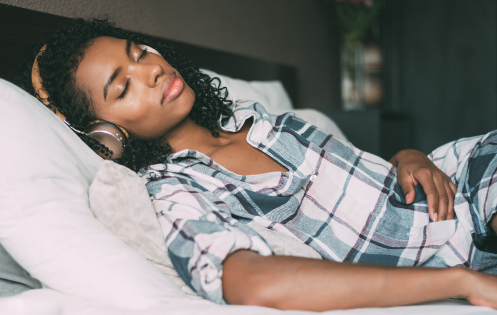 woman sleeping with headphones on