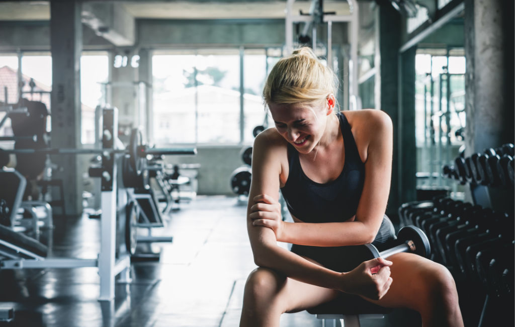 woman working out in pain