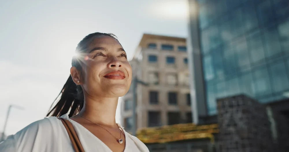  Asian businesswoman, city and smile by office buildings in morning