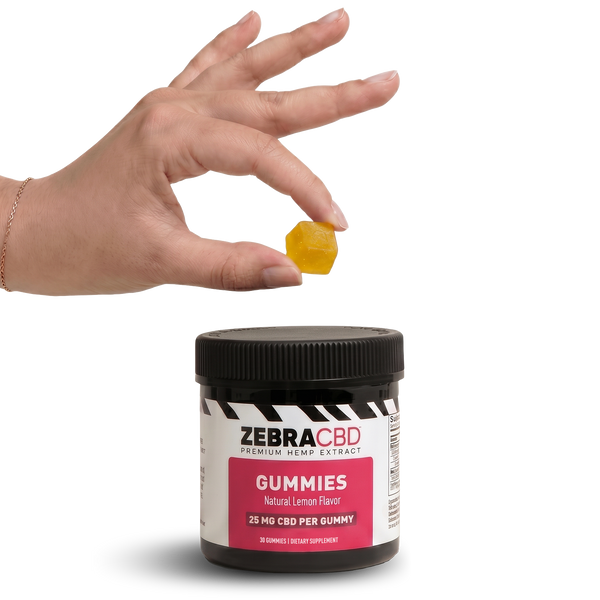 Zebra CBD gummies jar with a hand holding a gummy